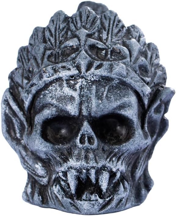 Gray carved skull-shaped whistle on white background